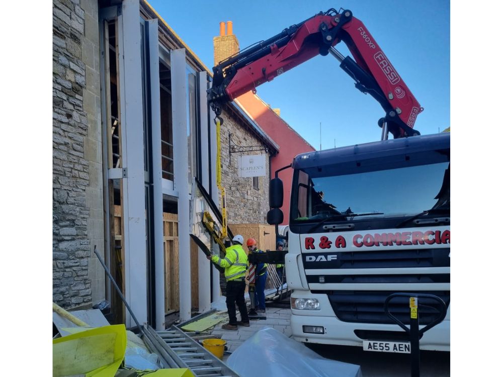  Scaplen's window being installed with heavy machinery