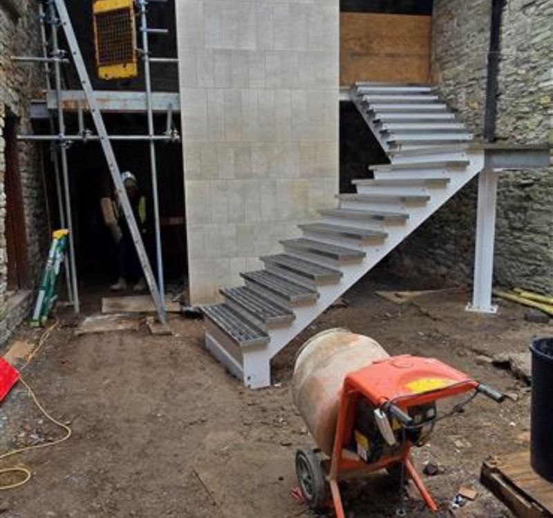 The courtyard steps being installed around the new lift shaft